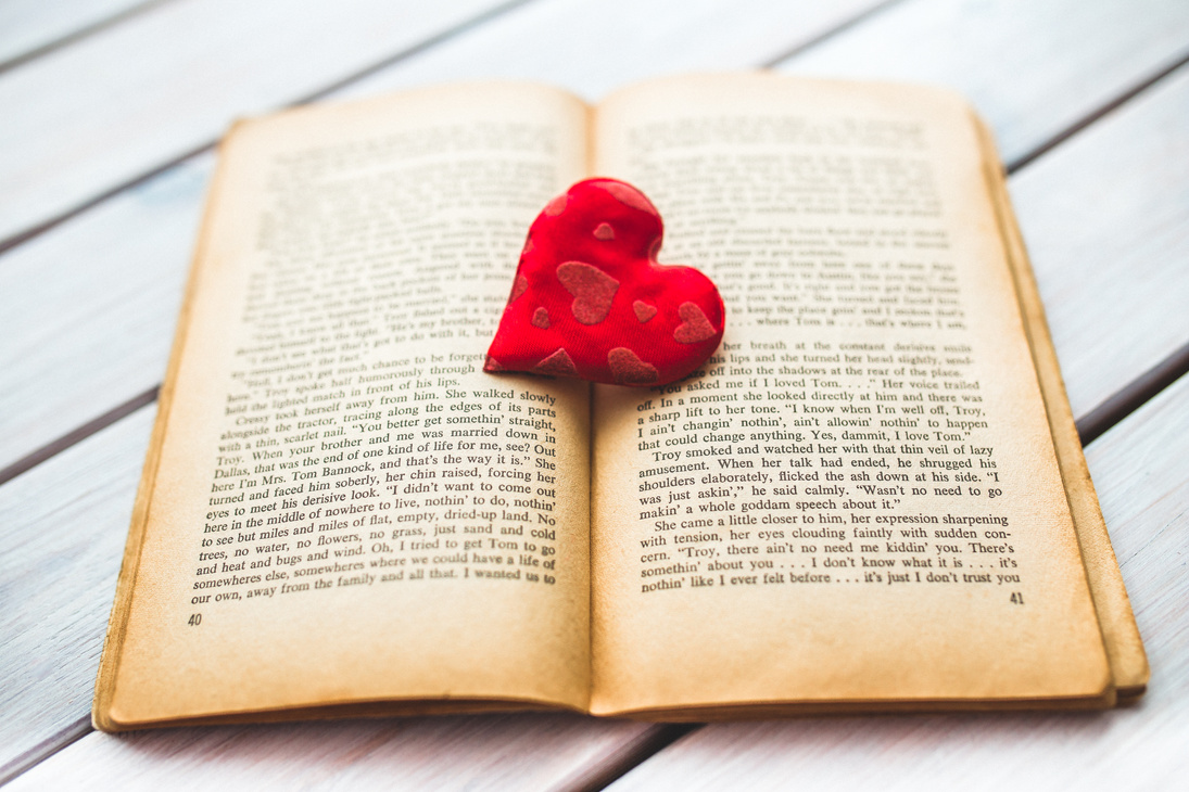 Red heart on a old opened book II